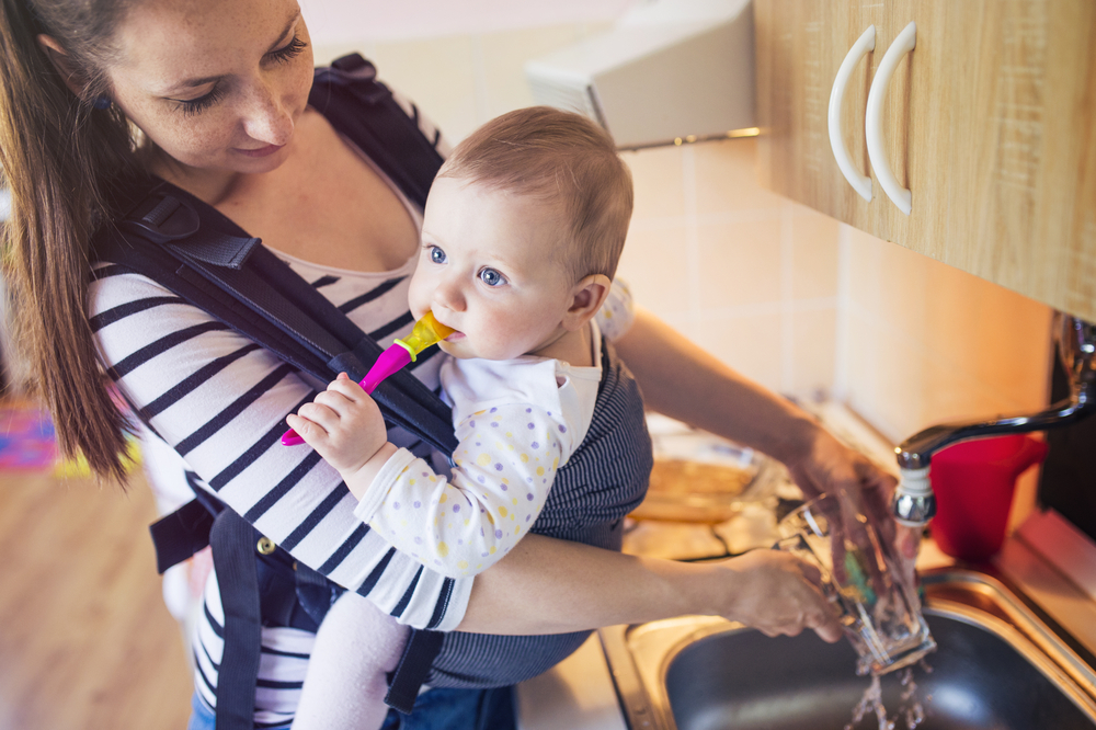 mom babywearing using a baby carrier