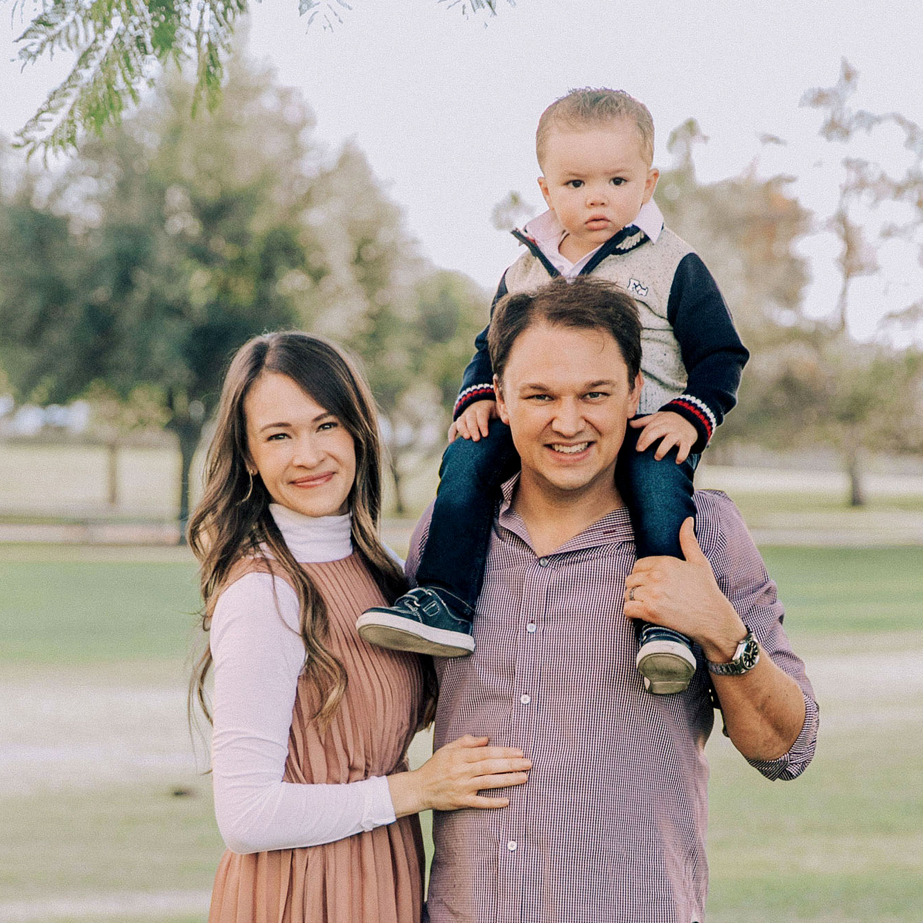 young family outside with young son