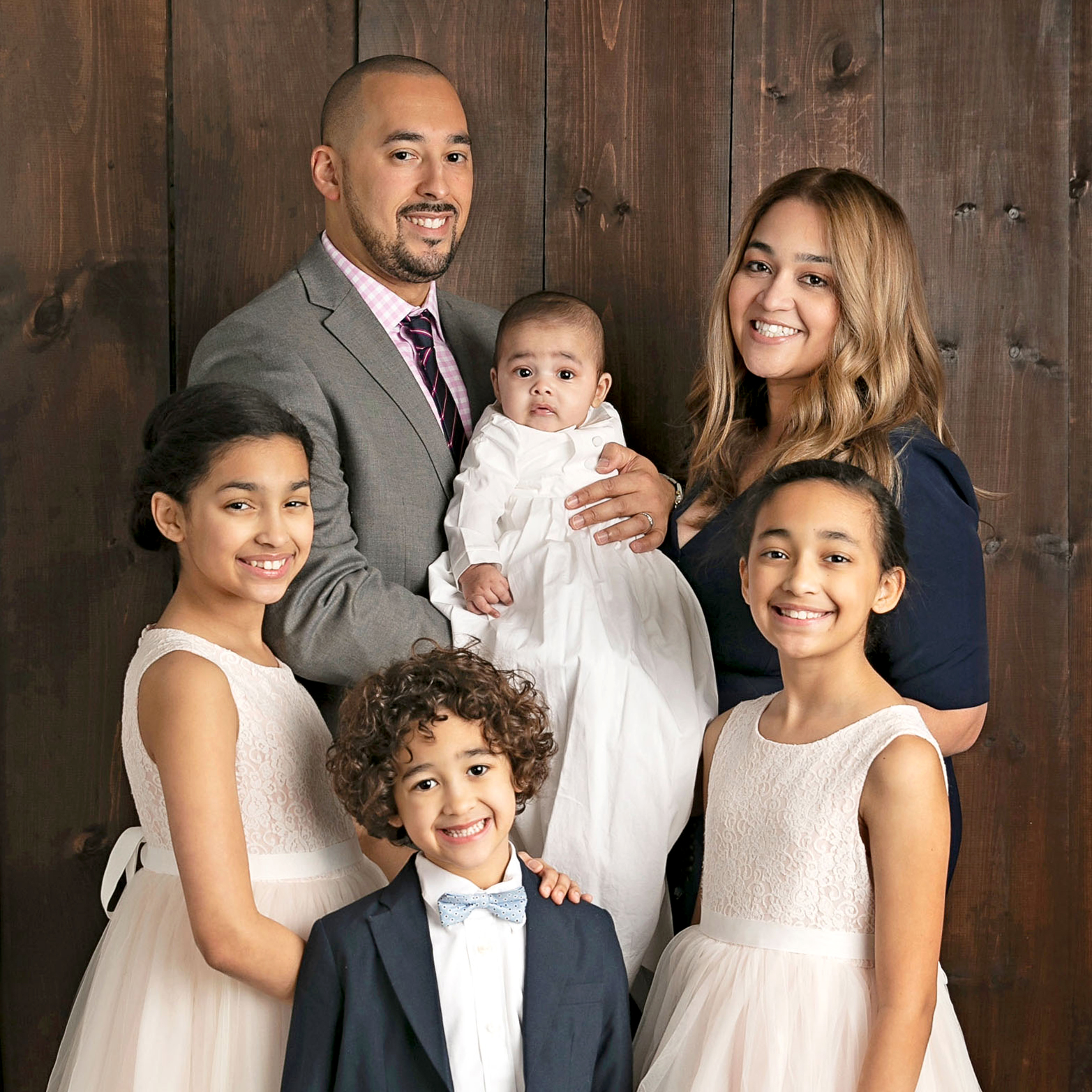 mother and father with four kids portrait