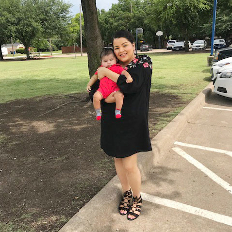 mother with infant outside near park