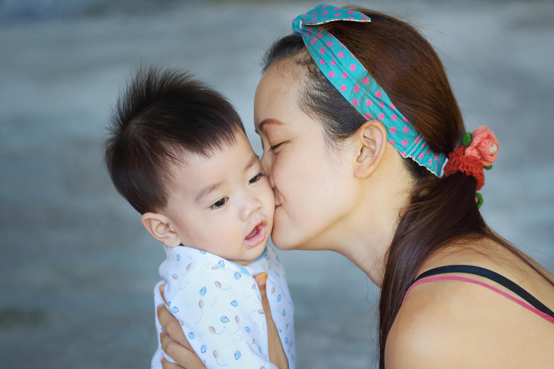 mom kissing baby boy