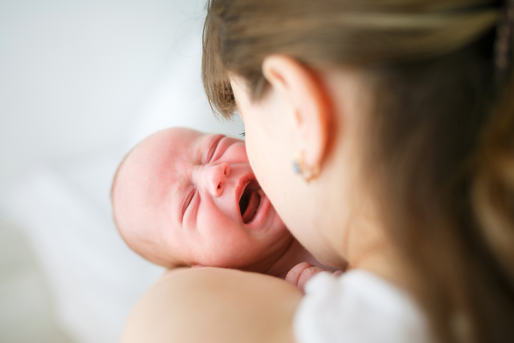 mom holding colicky baby