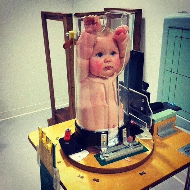 Baby in giant test tube is actually getting x-ray in Pigg-O-Stat